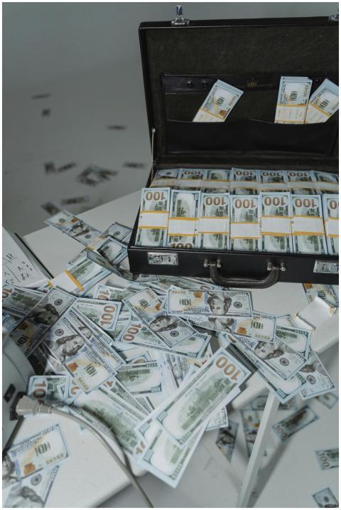 A briefcase overflowing with neatly stacked US dol