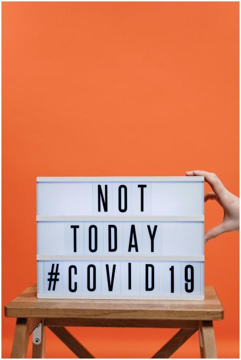 A motivational sign reading 'NOT TODAY #COVID19' a