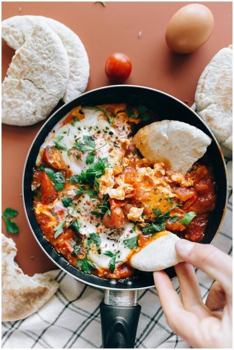 Savor a classic Shakshuka dish with vibrant tomato