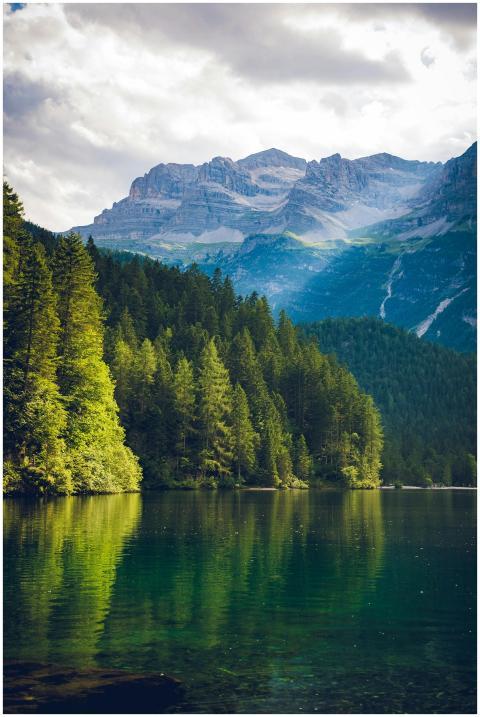 Peaceful alpine landscape featuring a serene lake