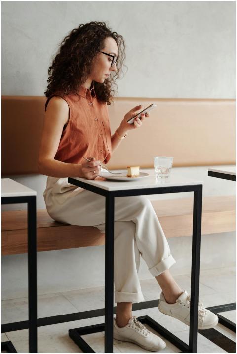 A young woman enjoys a quiet moment at a coffee sh