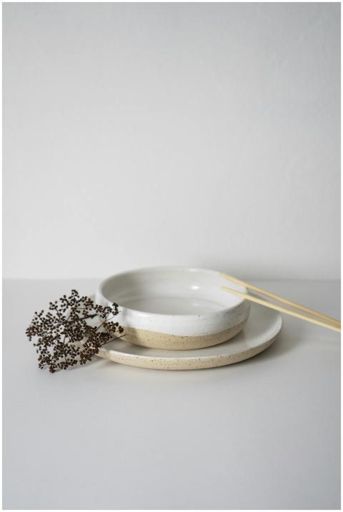 Simple and elegant white ceramic bowls with chopst