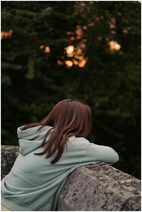 Pensive Woman Relaxing Outdoors