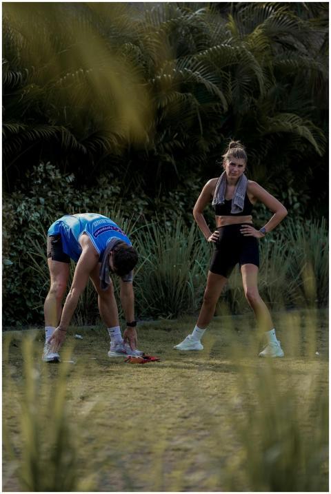 Two adults resting after a running session in a na