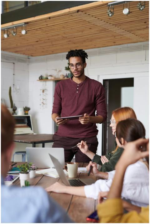 Young professionals engaged in a brainstorming ses