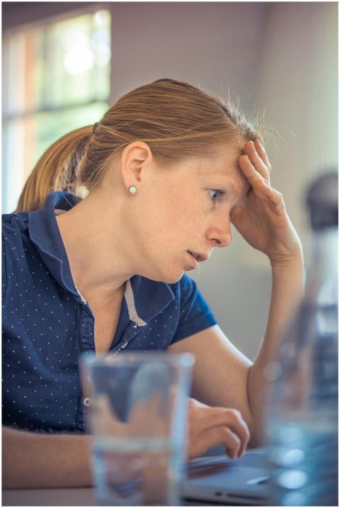 Businesswoman showing stress and concentration whi
