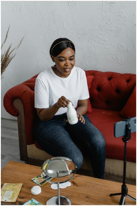 Woman recording a beauty product review for social