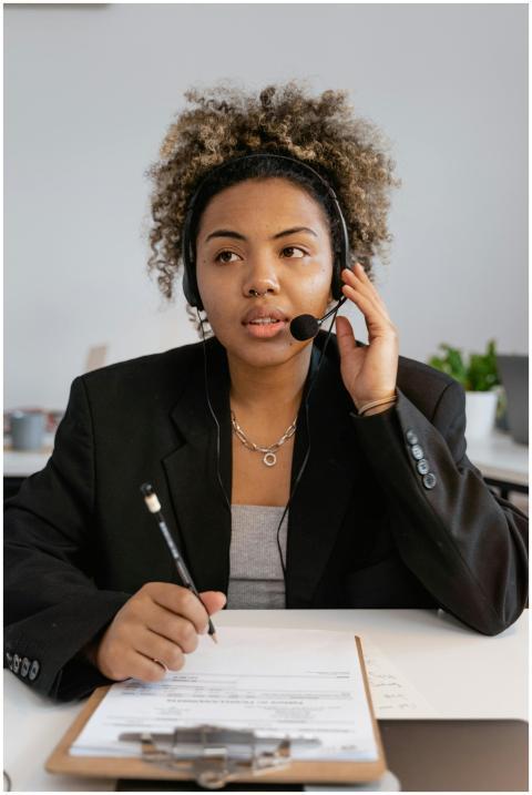 Woman with headset working in a call center enviro