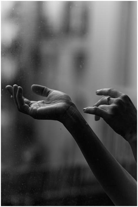 Captivating monochrome image of hands reaching out
