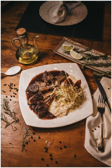 Elegant gourmet meal with mashed potatoes and herb