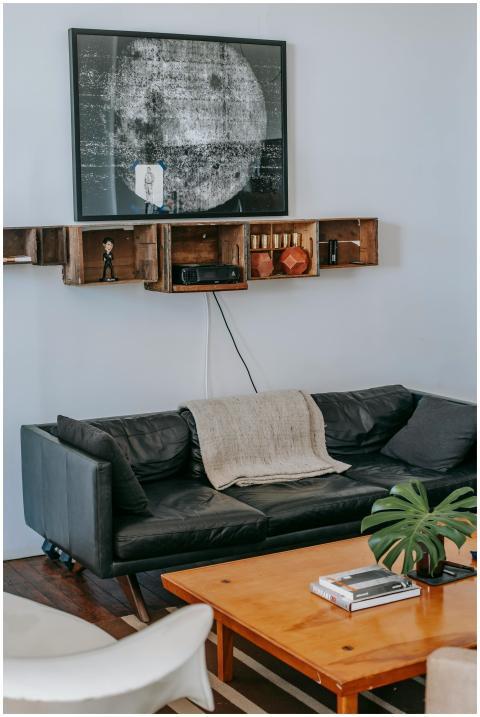 Comfortable black leather couch with cushions  nea