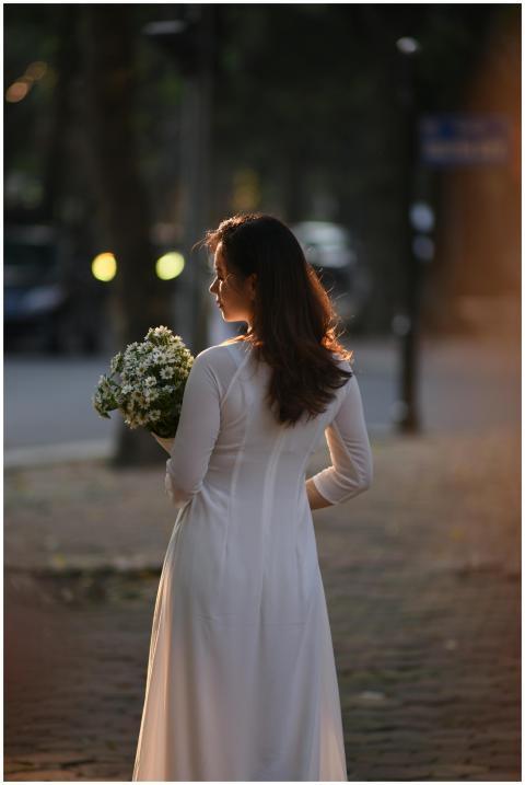 Elegant Woman Holding Flowers