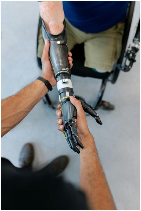Close-up of a man in a wheelchair with a prostheti
