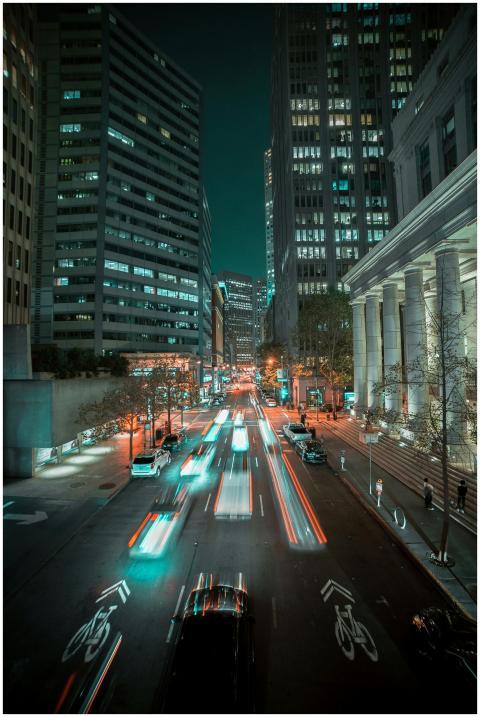 Long exposure of vibrant city traffic and skyscrap