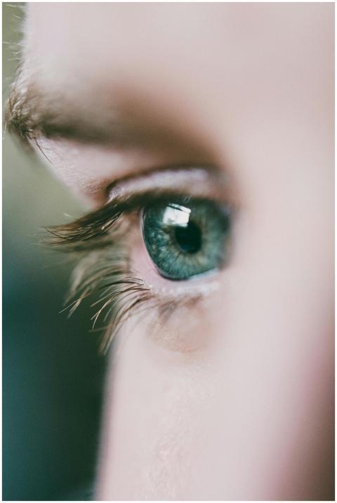 A detailed close-up shot of a blue eye showcasing