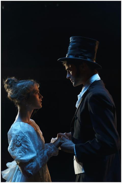 A dramatic theater scene depicting a couple in Vic