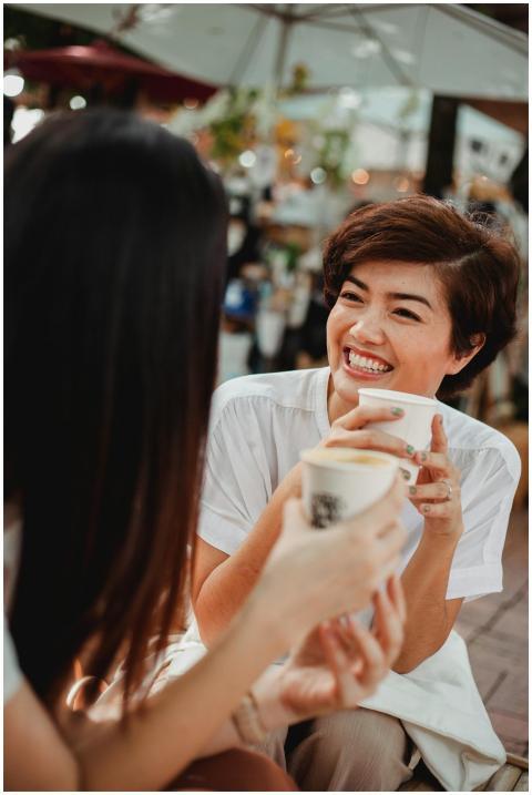 Two women enjoying a joyful coffee conversation ou