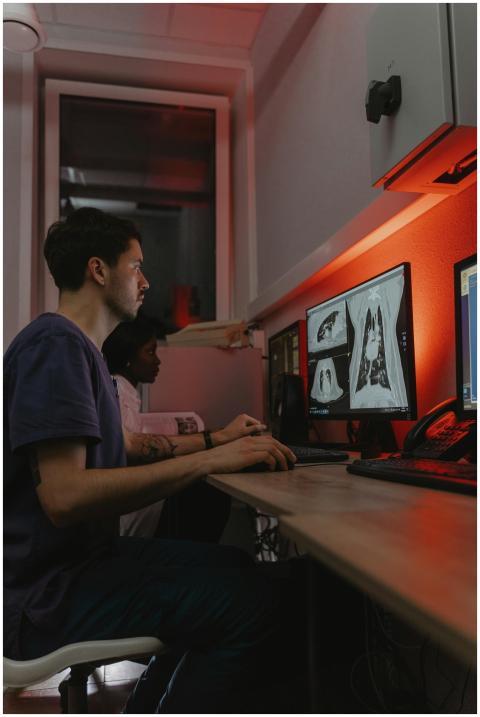 Doctors reviewing diagnostic X-ray images on compu