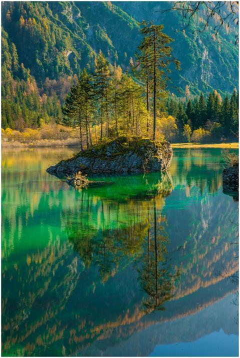 Stunning fall scenery of a tranquil mountain lake