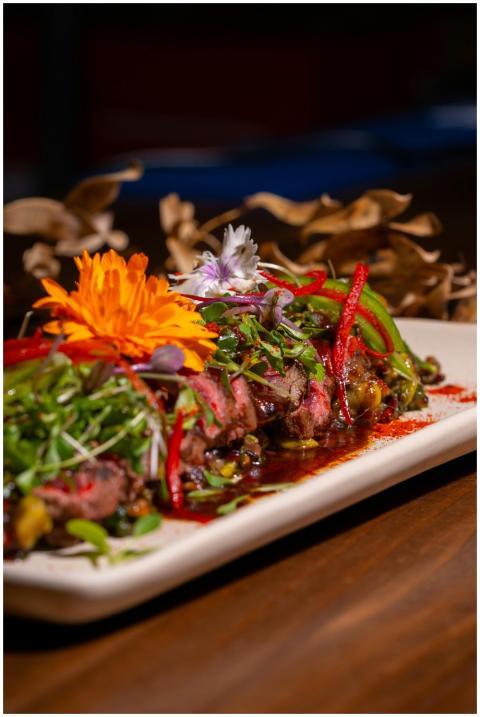 Exquisite plated gourmet dish adorned with vibrant