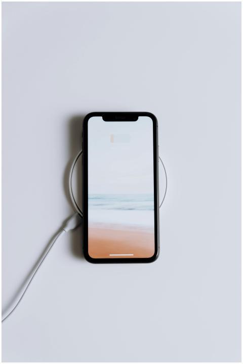 Minimalist smartphone on a wireless charger with a