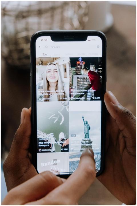 Close-up of a person using a smartphone to browse