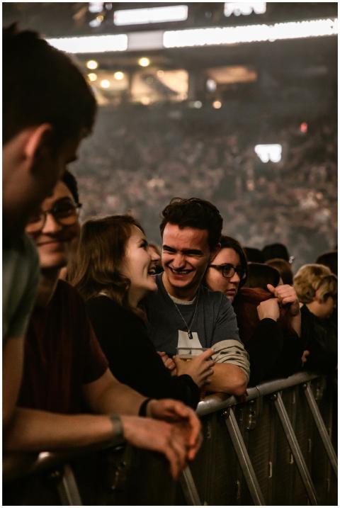 A lively crowd at a concert enjoying the performan