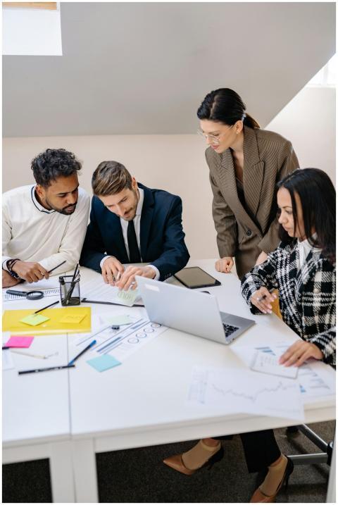 Business team brainstorming ideas at a workspace,