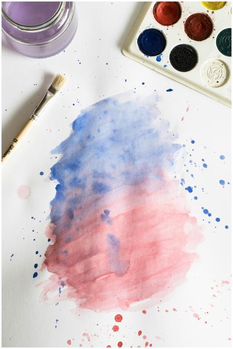 Vibrant watercolor painting with blue and red grad