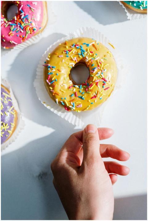 Close-up of a vibrant donut with colorful sprinkle