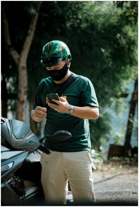 Man Helmet Using Smartphone
