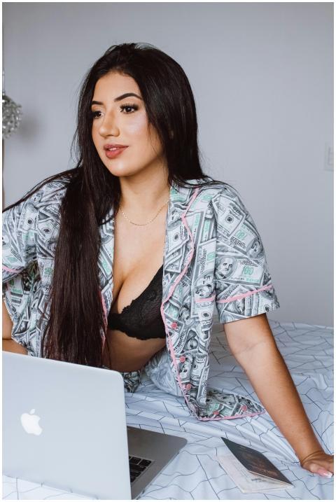 Confident woman in leisurewear working on a laptop