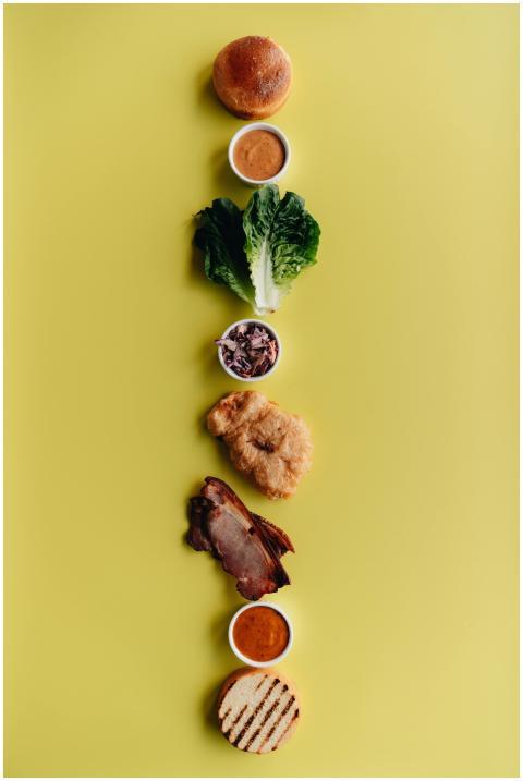 A visually appealing deconstructed burger with fre