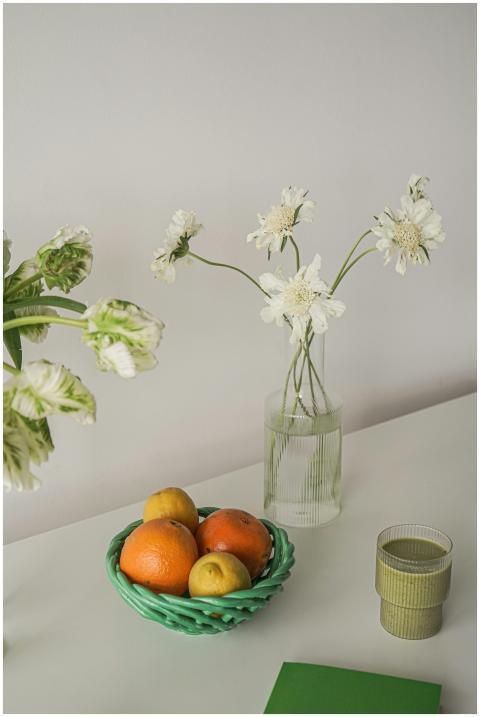 Elegant still life featuring citrus fruits and whi