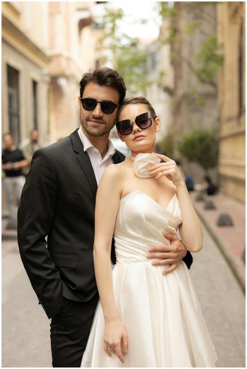 Elegant couple in wedding dress and suit posing ro