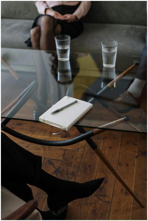 Close-up of a counseling session with two glasses