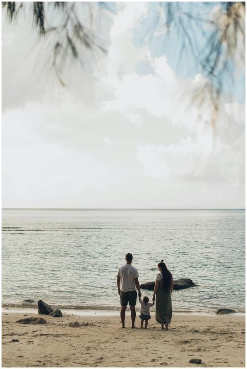 A family enjoys a tranquil day at the beach, highl