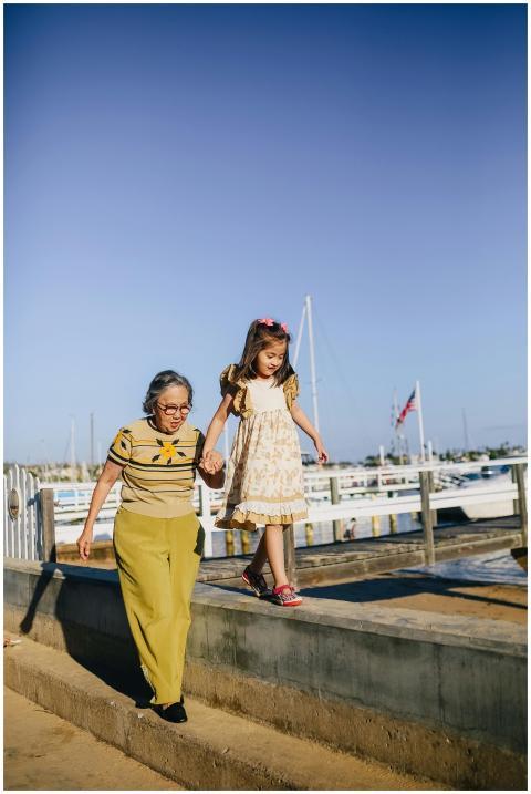 An elderly woman and a young girl enjoy a sunny da