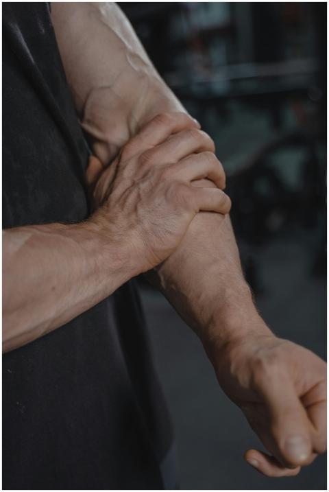 A detailed close-up of a muscular man adjusting hi