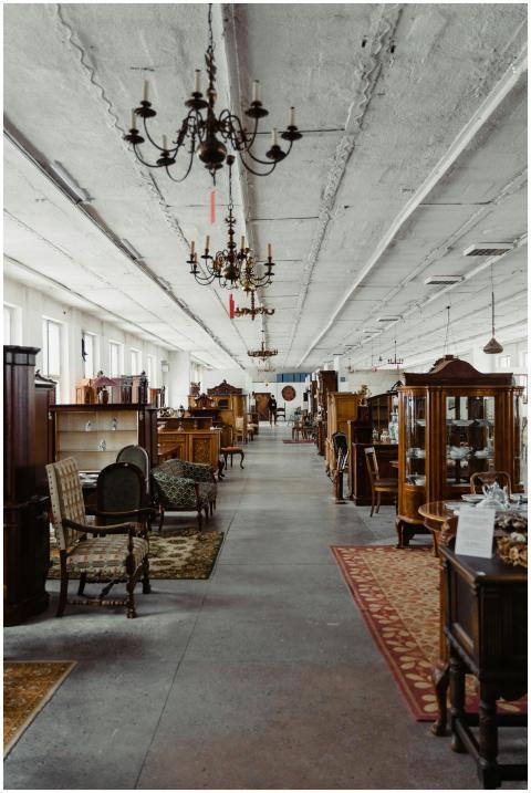 A long aisle in a vintage furniture store showcasi