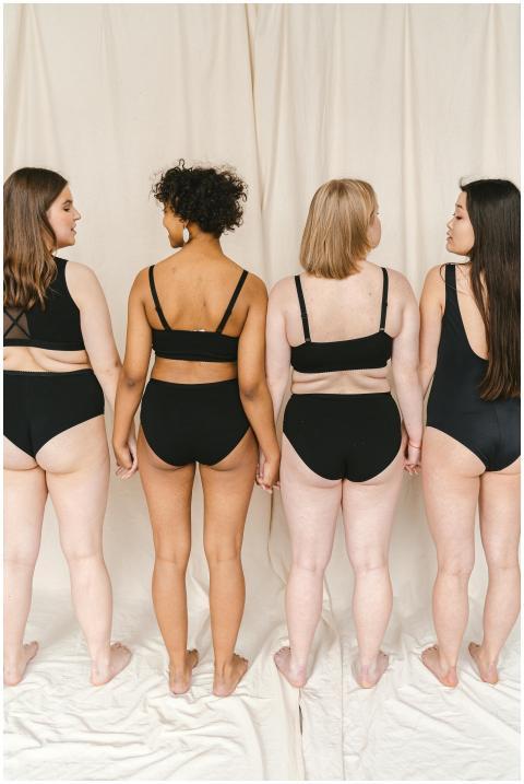 Diverse group of women in swimwear promoting body