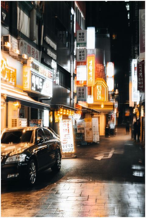Illuminated street in bustling Asian city with neo