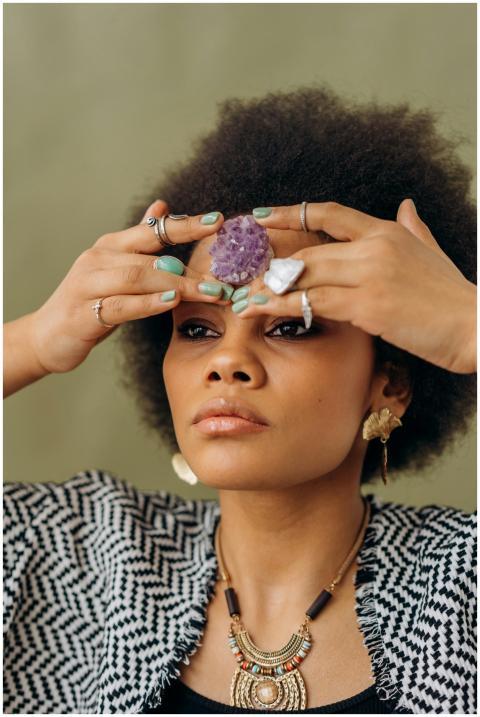 Portrait of a woman meditating with amethyst cryst