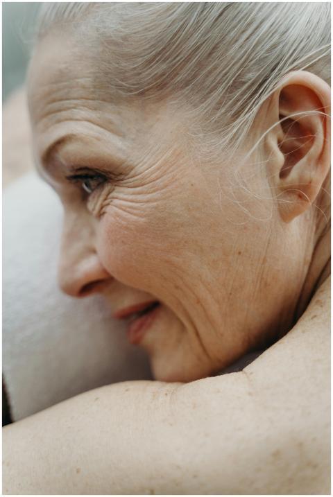 Close-up profile of an elderly woman with white ha