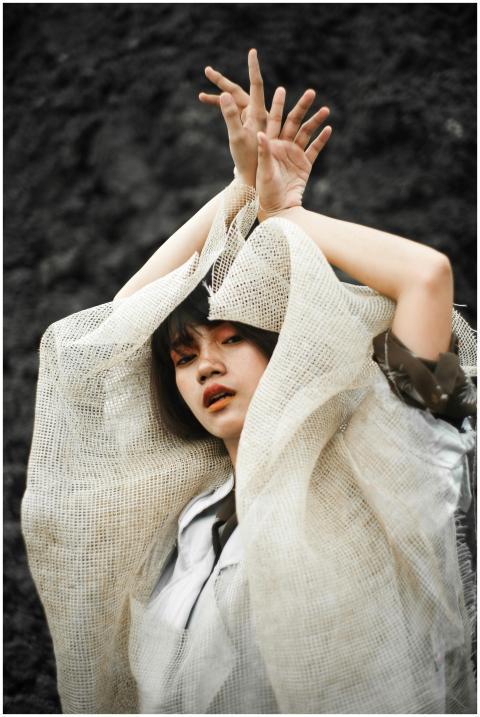 Artistic portrait of a woman posing elegantly in a