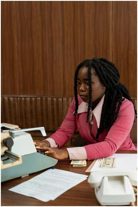 Retro-style image of a businesswoman using a typew