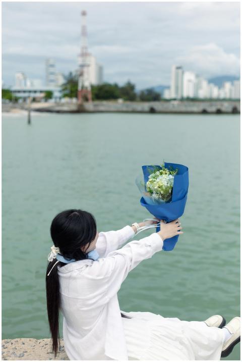 Young Woman Holding Flowers