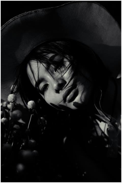 Artistic black and white portrait of a woman weari