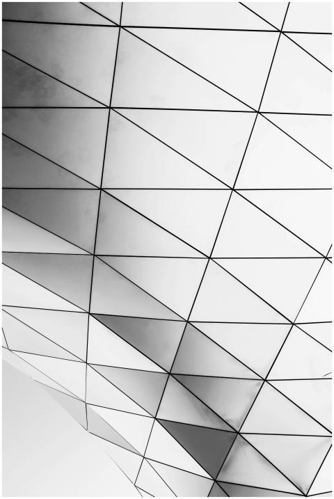 Black and white abstract image of a geometric arch