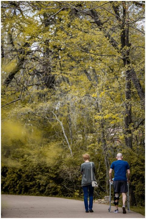 Back view full body of anonymous male in orthosis